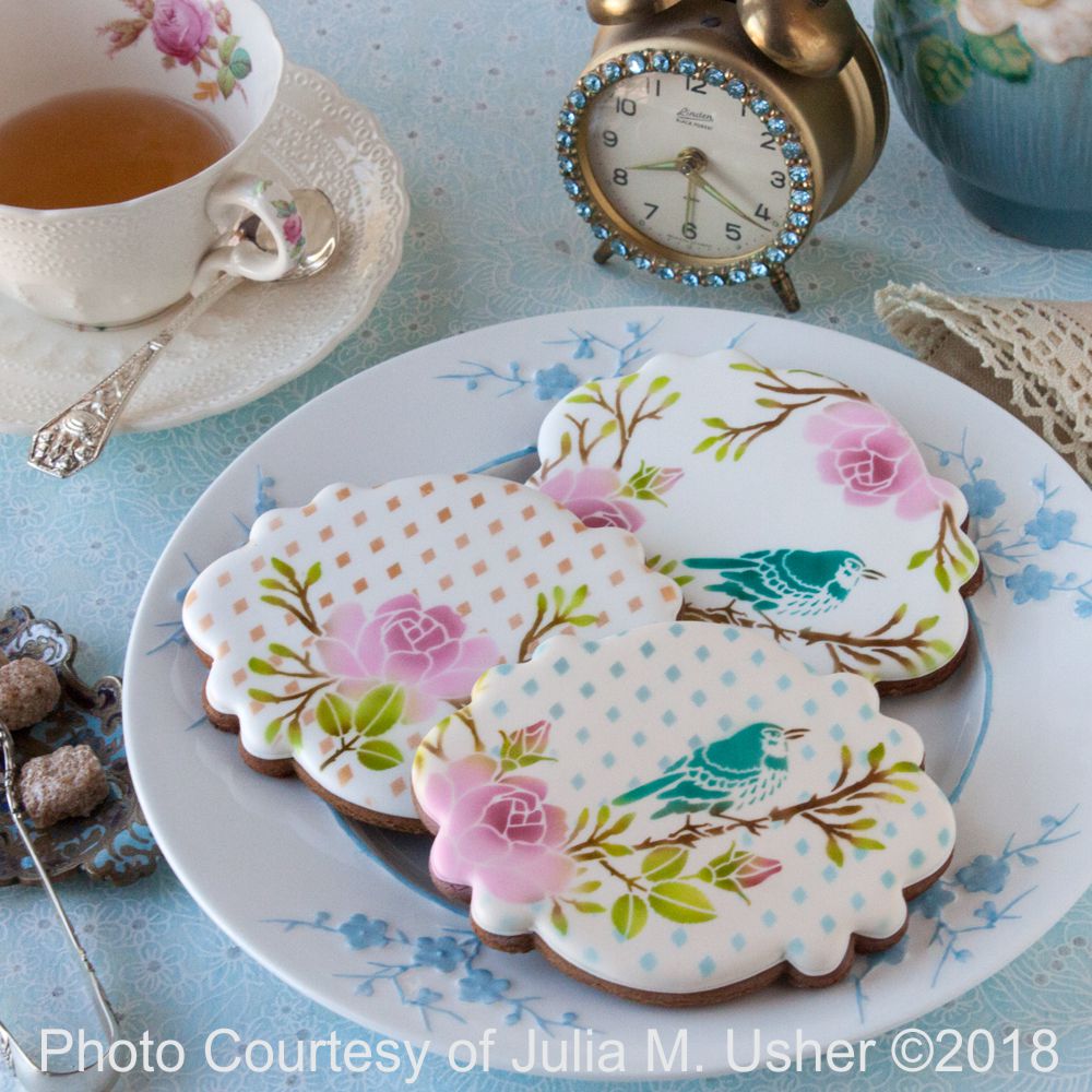 Iced and airbrushed cookies by Julia Usher using the In Bloom Dynamic Duos Cookie Stencil Set