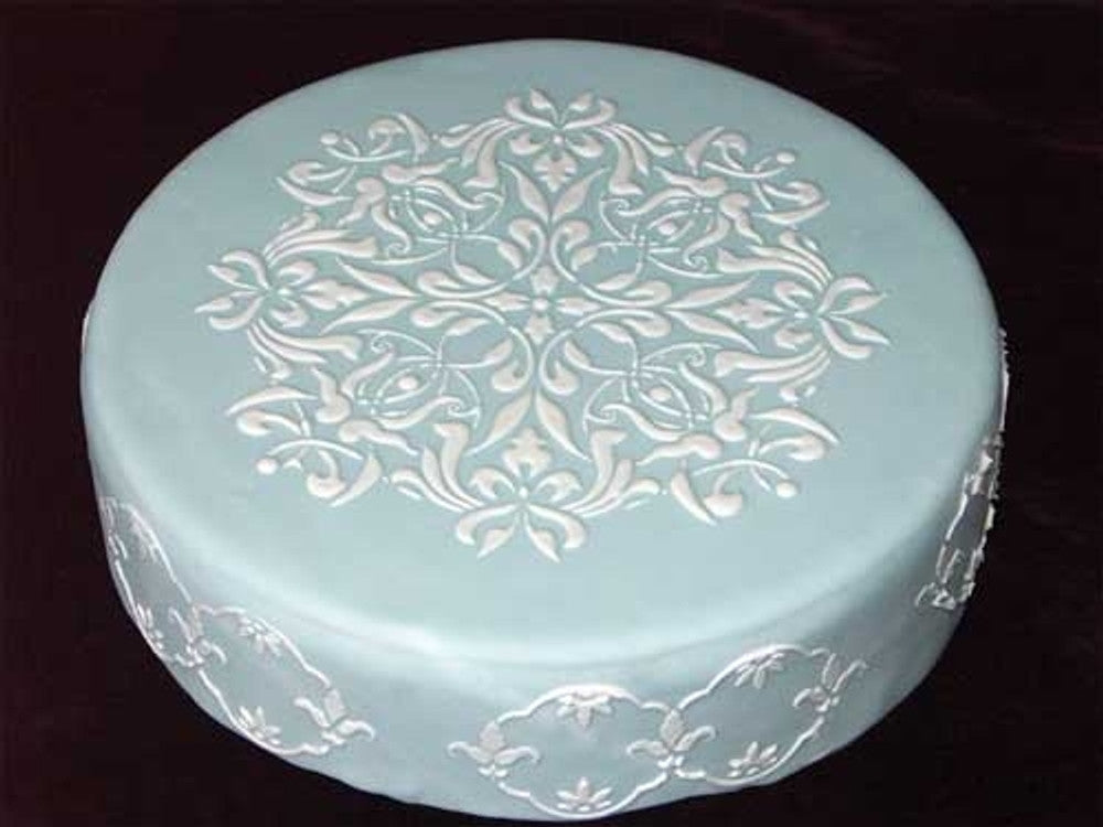 French Medallion Cake Stencil Top applied to a fondant wrapped cake with royal icing for a wedding