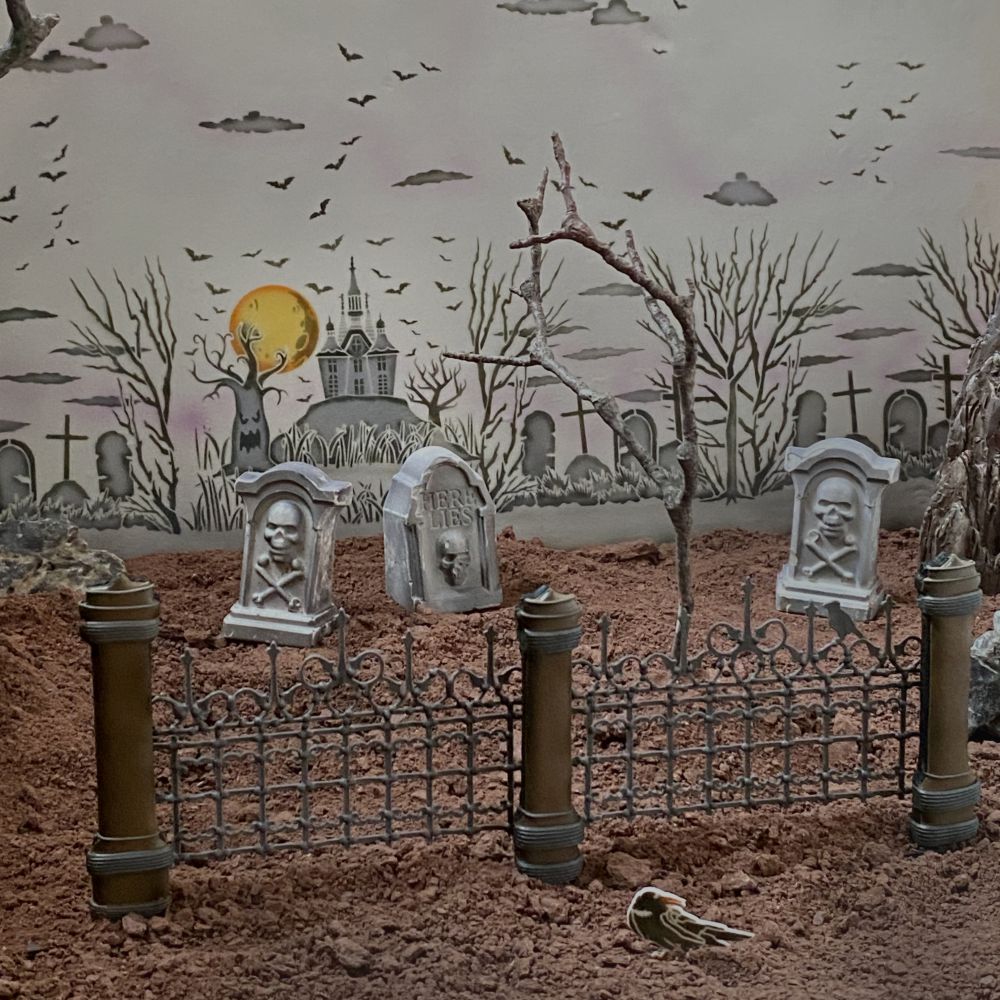 Graveyard scene made from cookies using the fence design in Hallows' Eve Background Stencil