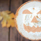 Pumpkin Cocktail decorated with halloween coffee and cocktail stencil