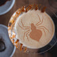 Halloween cocktail decorated on top with Halloween Coffee and Cocktail Stencil