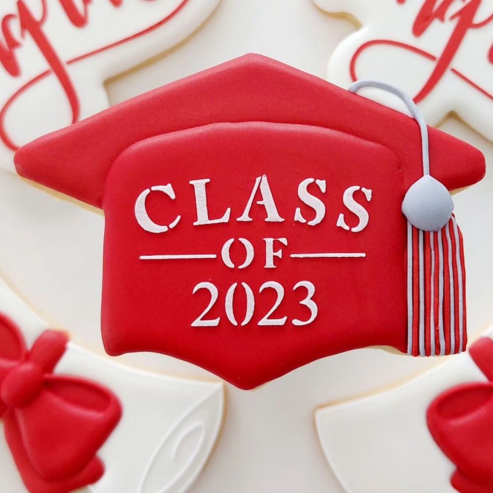 Cookie stenciled with royal icing with Graduation Words Cookie Stencil