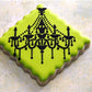 Chandelier Cake Stencil Side Set by Designer Stencils iced onto neon yellow cookies