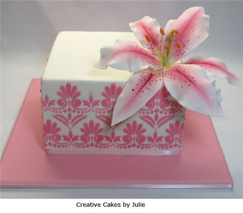 Birthday cake stenciled with fluer de lis pattern using Fleur de Lis Cake Stencil Sets by Designer Stencils