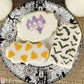Halloween decorated cookies with royal icing using Halloween cookie stencils